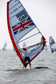 Qingdao, China, 20080807: 2008 OLYMPICS - Practice Race at Olympic Sailing Regatta before the real deal begins on Saturday. Bryony Shaw (GBR) . RS:X Class Women.  (No sale to Denmark)