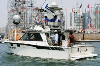 Qingdao, China, 20080807: 2008 OLYMPICS - Practice Race at Olympic Sailing Regatta before the real deal begins on Saturday. Media Boat.  (No sale to Denmark)