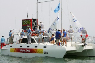 Qingdao, China, 20080807: 2008 OLYMPICS - Practice Race at Olympic Sailing Regatta before the real deal begins on Saturday. Race Commitee Boat.  (No sale to Denmark)