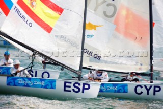 Qingdao, China, 20080809: 2008 OLYMPICS - first day of racing in the Olympic Sailing Event. Rafa Trujillo (ESP) - Finn Class.  (no sale to Denmark)