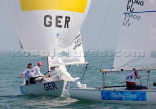 Qingdao, China, 20080809: 2008 OLYMPICS - first day of racing in the Olympic Sailing Event. SCHUEMANN Ulli/HOEPFNER Ute/BLECK Julia (GER) - Yngling Class.  (no sale to Denmark)