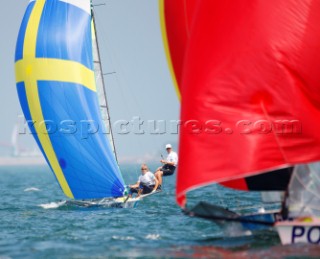 Qingdao, China, 20080810: 2008 OLYMPICS - second day of racing in the Olympic Sailing Event. Jonas Lindberg/Karl Torlen (SWE) - 49er Class.   (no sale to Denmark)