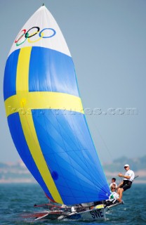 Qingdao, China, 20080810: 2008 OLYMPICS - second day of racing in the Olympic Sailing Event. Jonas Lindberg/Karl Torlen (SWE) - 49er Class.   (no sale to Denmark)
