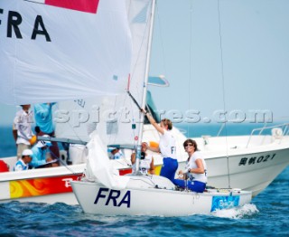 Qingdao, China, 20080810: 2008 OLYMPICS - second day of racing in the Olympic Sailing Event. Anne Le Helley/Catherine Lespant/Julie Gerecht (FRA) - Yngling Class.   (no sale to Denmark)