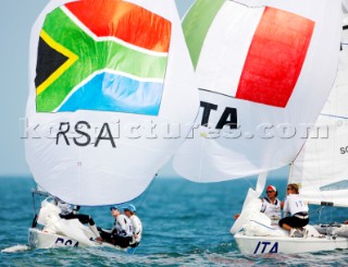 Qingdao, China, 20080810: 2008 OLYMPICS - second day of racing in the Olympic Sailing Event. Dominique Provoyeur/Kim Rew/Penny Alison (RSA) - Yngling Class.   (no sale to Denmark)