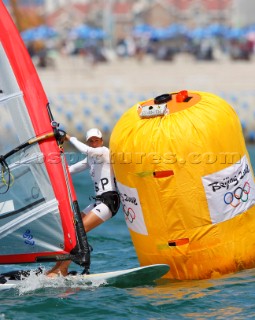 Qingdao, China, 20080811: 2008 OLYMPICS - third day of racing in the Olympic Sailing Event. Marina Alabau (ESP) -  RS:X Class.  (no sale to Denmark)