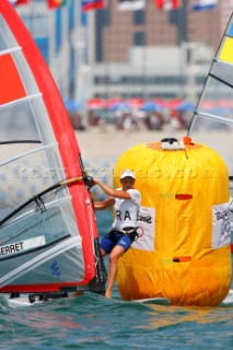 Qingdao, China, 20080811: 2008 OLYMPICS - third day of racing in the Olympic Sailing Event. Faustine Merret (FRA) -  RS:X Class.  (no sale to Denmark)