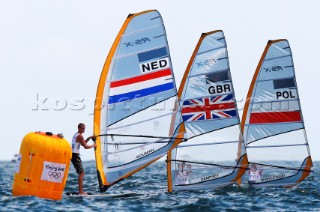 Qingdao, China, 20080811: 2008 OLYMPICS - third day of racing in the Olympic Sailing Event. Leeward mark rounding - Casper Boumann (NED) -  RS:X Class.  (no sale to Denmark)