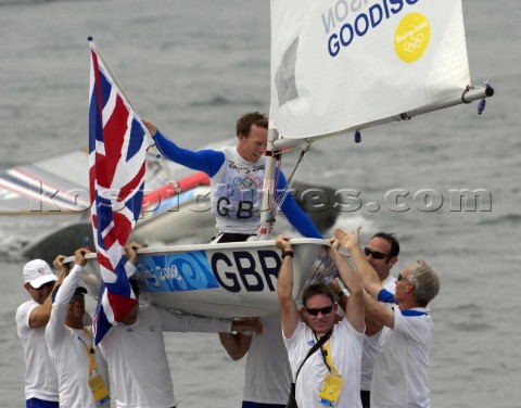 Paul Goodison wins Gold in Laser Class held aloft by team mates including Stephen Park team Manager 