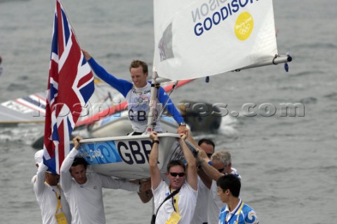 Paul Goodison wins Gold in Laser Class held aloft by team mates including Stephen Park team Manager 