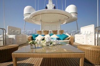 Superyacht deck sun lounger and sofa relaxation area