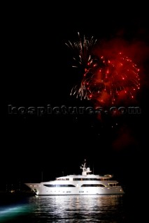 Benetti superyacht moored at anchor at night for social event