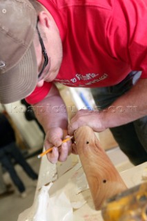 Workmen and boat builders at the Hinkley Shipyard and boat building facility