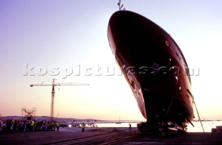 Lanscape of the build and launch party ceremony from a slipway of the red superyacht Elix