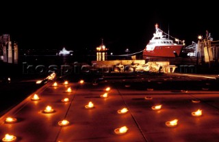 Lanscape of the build and launch party ceremony from a slipway of the red superyacht Elix