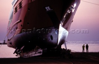 Lanscape of the build and launch party ceremony from a slipway of the red superyacht Elix