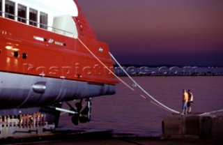 Lanscape of the build and launch party ceremony from a slipway of the red superyacht Elix