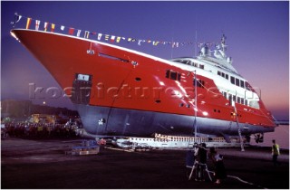 Lanscape of the build and launch party ceremony from a slipway of the red superyacht Elix