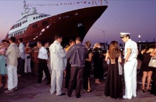 Lanscape of the build and launch party ceremony from a slipway of the red superyacht Elix