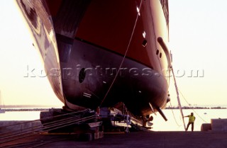 Lanscape of the build and launch party ceremony from a slipway of the red superyacht Elix