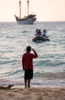 Going ashore by inflatable dinghy whilst cruising Malaysia on the tradional yacht Silolona