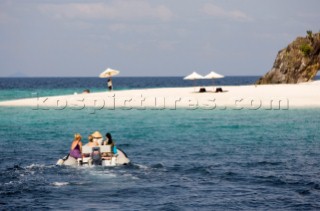 Going ashore by inflatable dinghy whilst cruising Malaysia on the tradional yacht Silolona