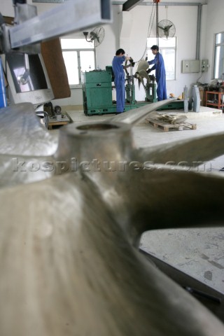 Yacht builders and skilled workers boatbuilding at the Cheoy Lee shipyard and boatbuilders in China