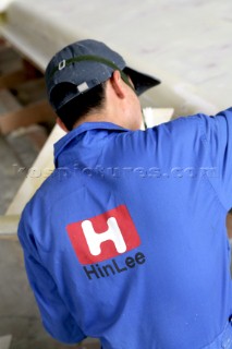 Yacht builders and skilled workers boatbuilding at the Cheoy Lee shipyard and boatbuilders in China