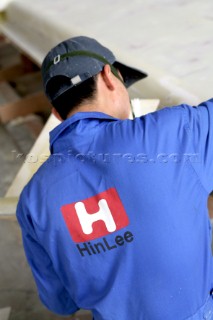 Yacht builders and skilled workers boatbuilding at the Cheoy Lee shipyard and boatbuilders in China