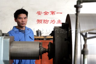 Yacht builders and skilled workers boatbuilding at the Cheoy Lee shipyard and boatbuilders in China