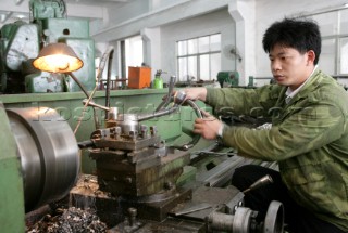 Yacht builders and skilled workers boatbuilding at the Cheoy Lee shipyard and boatbuilders in China