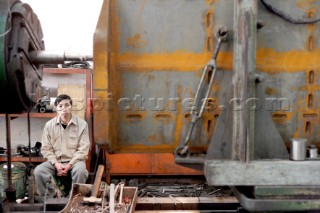 Yacht builders and skilled workers boatbuilding at the Cheoy Lee shipyard and boatbuilders in China