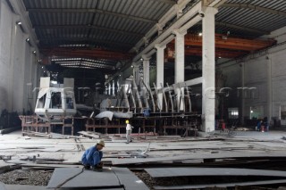 Yacht builders and skilled workers boatbuilding at the Cheoy Lee shipyard and boatbuilders in China. Welders welding.