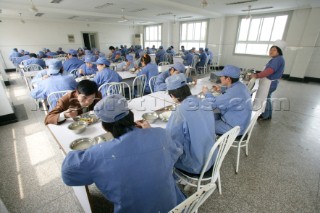 Yacht builders and skilled workers boatbuilding at the Double Happiness shipyard and boatbuilders in China