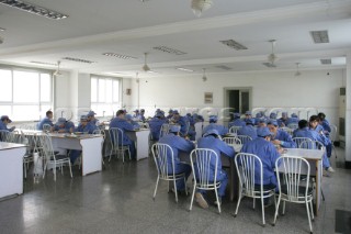 Yacht builders and skilled workers boatbuilding at the Double Happiness shipyard and boatbuilders in China