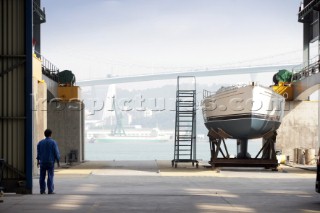 Yacht builders and skilled workers boatbuilding at the Hansheng shipyard and boatbuilders in China