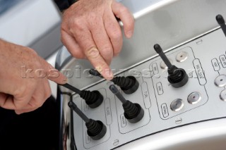 Operating electronic instrument controls onboard the sailing superyacht YII Y2 near San Remo