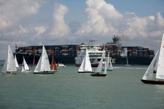 Skandia Cowes Week 2008 - Commercial container ship moves through traffic and navigation congestion in confined waters of the Solent. Potential collisions are common.