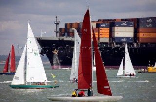 Skandia Cowes Week 2008 - Commercial container ship moves through traffic and navigation congestion in confined waters of the Solent. Potential collisions are common.