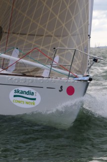 bow of racing yacht sailing upwind at the start of the race Cowes Week Isle of Wight 2008