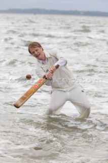 THE SOLENT, UK - August 31st: For a briefÊspellÊonce each summer on the lowest of spring tides, members of the Island Sailing Club and Royal Southern Yacht Club sail outÊto The Brambles sand bank in the middle of The Solent andÊplay cricket, before the tide rushes back in one hour later.ÊThe fixture was first started in the 1950Õs by the late Uffa Fox, a sailing companion of the Duke of Edinburgh, the Royal Southern and the Island Sailing Club compete every year. As soon as the sandbank appears the stumps are put up and the match gets under way. Many of the competitors dress all in cricket whites and ÔThe Bramble InnÕ is erected to serve drinks to spectators. The Bramble Inn is one of the most bizarre pubs in England: it is in the middle of the sea and exists only for about an hour each year.