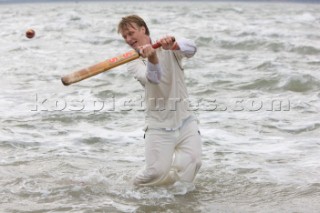 THE SOLENT, UK - August 31st: For a briefÊspellÊonce each summer on the lowest of spring tides, members of the Island Sailing Club and Royal Southern Yacht Club sail outÊto The Brambles sand bank in the middle of The Solent andÊplay cricket, before the tide rushes back in one hour later.ÊThe fixture was first started in the 1950Õs by the late Uffa Fox, a sailing companion of the Duke of Edinburgh, the Royal Southern and the Island Sailing Club compete every year. As soon as the sandbank appears the stumps are put up and the match gets under way. Many of the competitors dress all in cricket whites and ÔThe Bramble InnÕ is erected to serve drinks to spectators. The Bramble Inn is one of the most bizarre pubs in England: it is in the middle of the sea and exists only for about an hour each year.