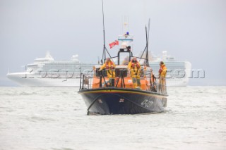 THE SOLENT, UK - August 31st: For a briefÊspellÊonce each summer on the lowest of spring tides, members of the Island Sailing Club and Royal Southern Yacht Club sail outÊto The Brambles sand bank in the middle of The Solent andÊplay cricket, before the tide rushes back in one hour later.ÊThe fixture was first started in the 1950Õs by the late Uffa Fox, a sailing companion of the Duke of Edinburgh, the Royal Southern and the Island Sailing Club compete every year. As soon as the sandbank appears the stumps are put up and the match gets under way. Many of the competitors dress all in cricket whites and ÔThe Bramble InnÕ is erected to serve drinks to spectators. The Bramble Inn is one of the most bizarre pubs in England: it is in the middle of the sea and exists only for about an hour each year.