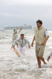 THE SOLENT, UK - August 31st: For a briefÊspellÊonce each summer on the lowest of spring tides, members of the Island Sailing Club and Royal Southern Yacht Club sail outÊto The Brambles sand bank in the middle of The Solent andÊplay cricket, before the tide rushes back in one hour later.ÊThe fixture was first started in the 1950Õs by the late Uffa Fox, a sailing companion of the Duke of Edinburgh, the Royal Southern and the Island Sailing Club compete every year. As soon as the sandbank appears the stumps are put up and the match gets under way. Many of the competitors dress all in cricket whites and ÔThe Bramble InnÕ is erected to serve drinks to spectators. The Bramble Inn is one of the most bizarre pubs in England: it is in the middle of the sea and exists only for about an hour each year.