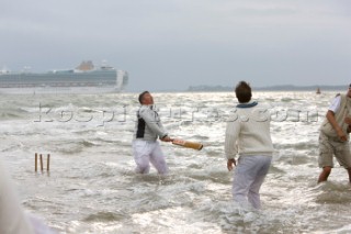 THE SOLENT, UK - August 31st: For a briefÊspellÊonce each summer on the lowest of spring tides, members of the Island Sailing Club and Royal Southern Yacht Club sail outÊto The Brambles sand bank in the middle of The Solent andÊplay cricket, before the tide rushes back in one hour later.ÊThe fixture was first started in the 1950Õs by the late Uffa Fox, a sailing companion of the Duke of Edinburgh, the Royal Southern and the Island Sailing Club compete every year. As soon as the sandbank appears the stumps are put up and the match gets under way. Many of the competitors dress all in cricket whites and ÔThe Bramble InnÕ is erected to serve drinks to spectators. The Bramble Inn is one of the most bizarre pubs in England: it is in the middle of the sea and exists only for about an hour each year.