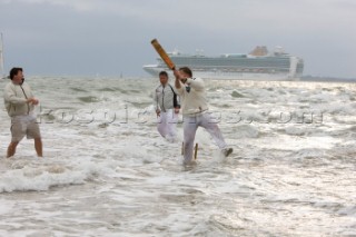 THE SOLENT, UK - August 31st: For a briefÊspellÊonce each summer on the lowest of spring tides, members of the Island Sailing Club and Royal Southern Yacht Club sail outÊto The Brambles sand bank in the middle of The Solent andÊplay cricket, before the tide rushes back in one hour later.ÊThe fixture was first started in the 1950Õs by the late Uffa Fox, a sailing companion of the Duke of Edinburgh, the Royal Southern and the Island Sailing Club compete every year. As soon as the sandbank appears the stumps are put up and the match gets under way. Many of the competitors dress all in cricket whites and ÔThe Bramble InnÕ is erected to serve drinks to spectators. The Bramble Inn is one of the most bizarre pubs in England: it is in the middle of the sea and exists only for about an hour each year.