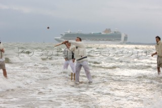 THE SOLENT, UK - August 31st: For a briefÊspellÊonce each summer on the lowest of spring tides, members of the Island Sailing Club and Royal Southern Yacht Club sail outÊto The Brambles sand bank in the middle of The Solent andÊplay cricket, before the tide rushes back in one hour later.ÊThe fixture was first started in the 1950Õs by the late Uffa Fox, a sailing companion of the Duke of Edinburgh, the Royal Southern and the Island Sailing Club compete every year. As soon as the sandbank appears the stumps are put up and the match gets under way. Many of the competitors dress all in cricket whites and ÔThe Bramble InnÕ is erected to serve drinks to spectators. The Bramble Inn is one of the most bizarre pubs in England: it is in the middle of the sea and exists only for about an hour each year.