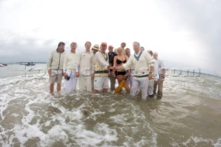 THE SOLENT, UK - August 31st: For a briefÊspellÊonce each summer on the lowest of spring tides, members of the Island Sailing Club and Royal Southern Yacht Club sail outÊto The Brambles sand bank in the middle of The Solent andÊplay cricket, before the tide rushes back in one hour later.ÊThe fixture was first started in the 1950Õs by the late Uffa Fox, a sailing companion of the Duke of Edinburgh, the Royal Southern and the Island Sailing Club compete every year. As soon as the sandbank appears the stumps are put up and the match gets under way. Many of the competitors dress all in cricket whites and ÔThe Bramble InnÕ is erected to serve drinks to spectators. The Bramble Inn is one of the most bizarre pubs in England: it is in the middle of the sea and exists only for about an hour each year.