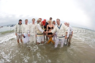 THE SOLENT, UK - August 31st: For a briefÊspellÊonce each summer on the lowest of spring tides, members of the Island Sailing Club and Royal Southern Yacht Club sail outÊto The Brambles sand bank in the middle of The Solent andÊplay cricket, before the tide rushes back in one hour later.ÊThe fixture was first started in the 1950Õs by the late Uffa Fox, a sailing companion of the Duke of Edinburgh, the Royal Southern and the Island Sailing Club compete every year. As soon as the sandbank appears the stumps are put up and the match gets under way. Many of the competitors dress all in cricket whites and ÔThe Bramble InnÕ is erected to serve drinks to spectators. The Bramble Inn is one of the most bizarre pubs in England: it is in the middle of the sea and exists only for about an hour each year.