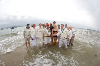 THE SOLENT, UK - August 31st: For a briefÊspellÊonce each summer on the lowest of spring tides, members of the Island Sailing Club and Royal Southern Yacht Club sail outÊto The Brambles sand bank in the middle of The Solent andÊplay cricket, before the tide rushes back in one hour later.ÊThe fixture was first started in the 1950Õs by the late Uffa Fox, a sailing companion of the Duke of Edinburgh, the Royal Southern and the Island Sailing Club compete every year. As soon as the sandbank appears the stumps are put up and the match gets under way. Many of the competitors dress all in cricket whites and ÔThe Bramble InnÕ is erected to serve drinks to spectators. The Bramble Inn is one of the most bizarre pubs in England: it is in the middle of the sea and exists only for about an hour each year.